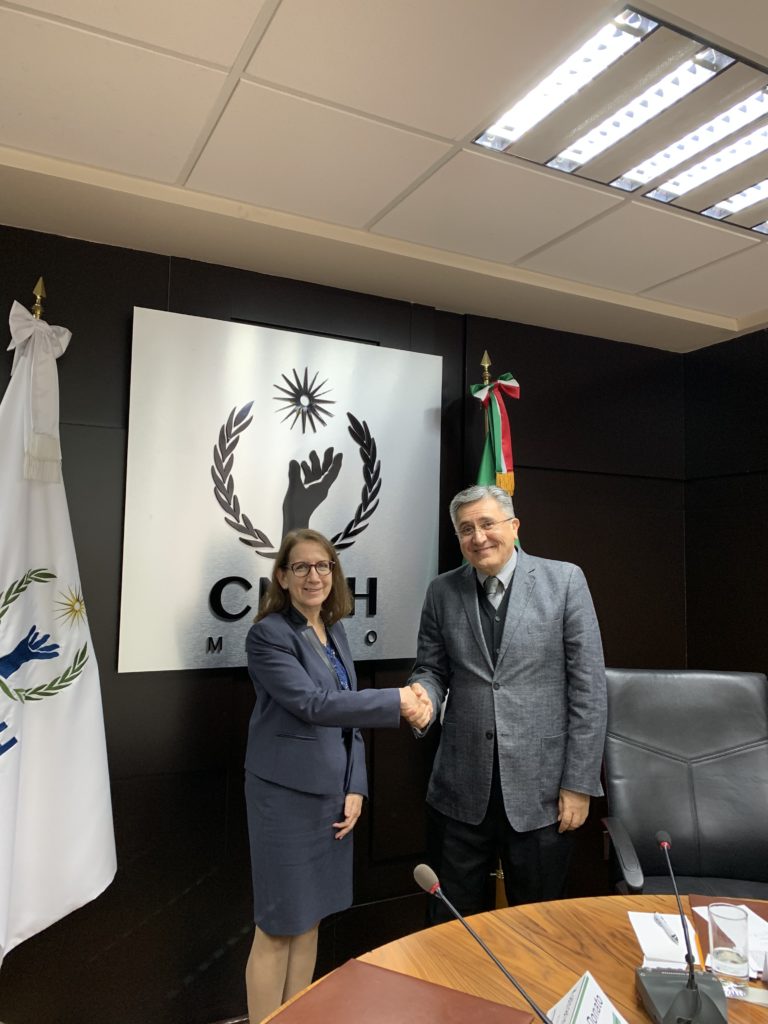 Katharine Donato and CNDH President Luis Raúl González Pérez